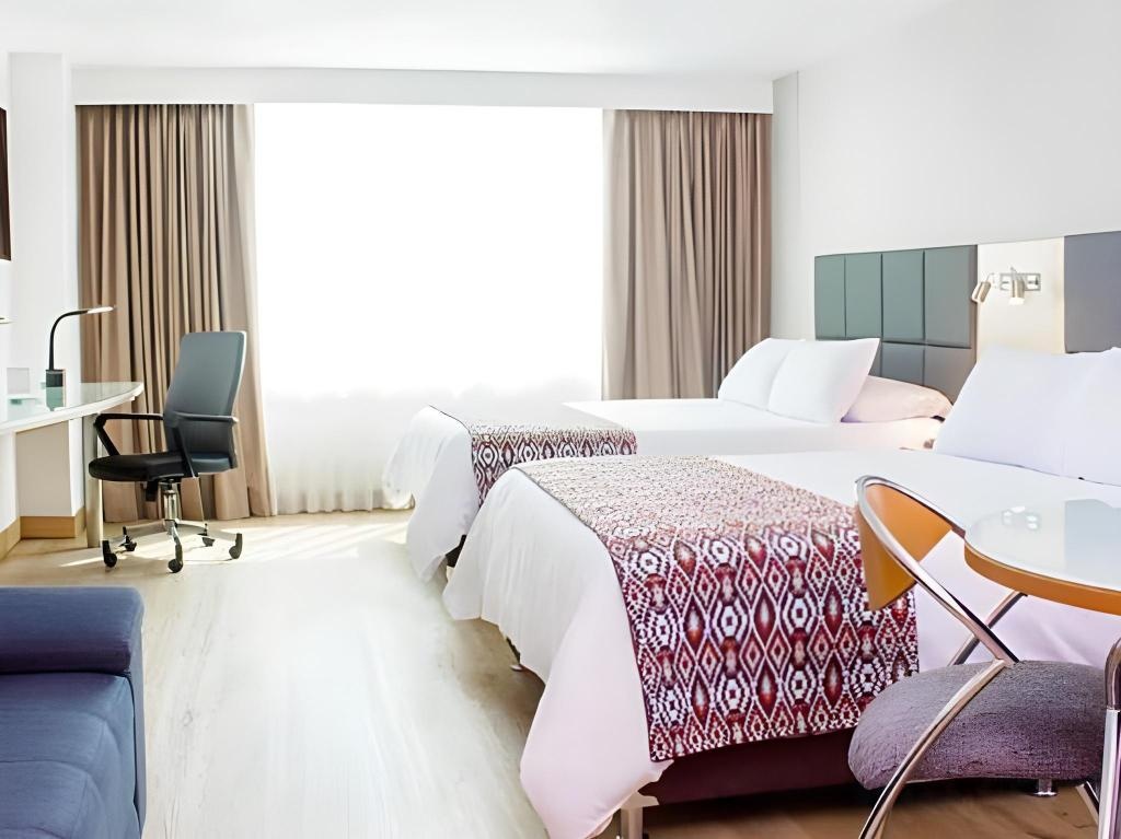 Novelty Suites Hotel  Rooms  Rooms Image 11 11