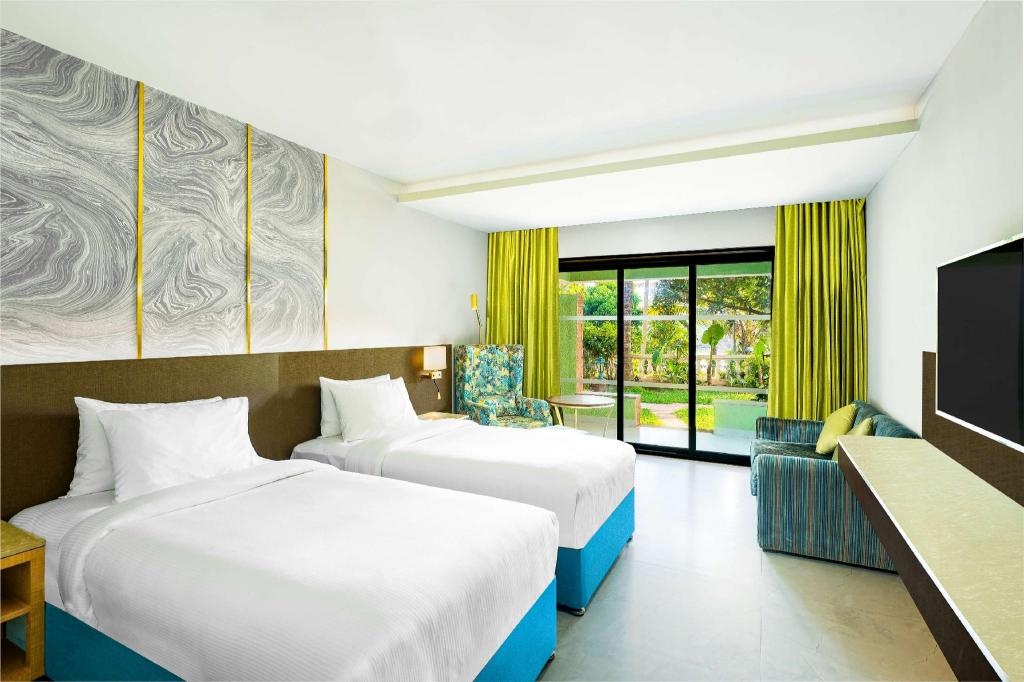 DoubleTree By Hilton Hotel Goa Arpora Baga  Rooms  Premium Twin Room With Garden Access Guestroom 11