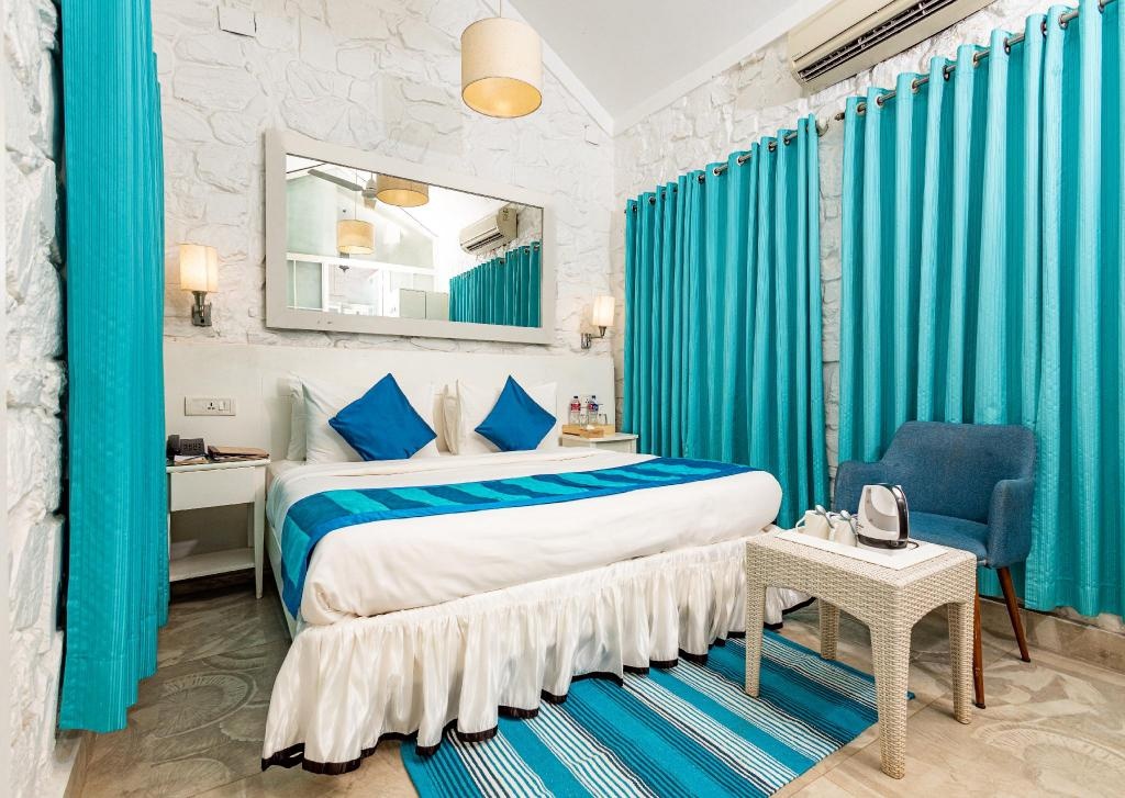 The Tamarind Hotel Anjuna Goa  Rooms  Deluxe Room With Pool View Bed 9