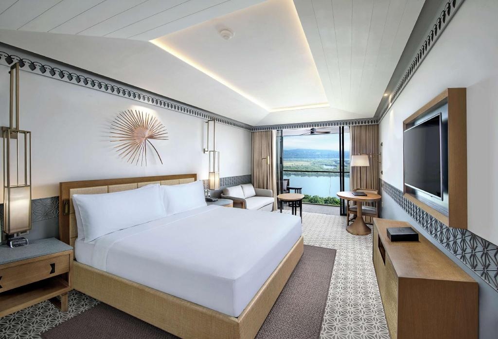 DoubleTree By Hilton Goa Panaji  Rooms  King Deluxe Room River View With Balcony Bedroom 4