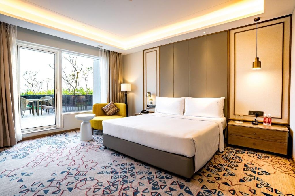 Holiday Inn Lucknow Airport By IHG  Rooms  1 Bedroom Suite Dining Area Balcony 1