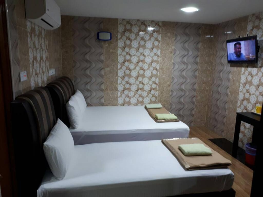 New Wave Hotel Nilai 1roomsQuad Room View6