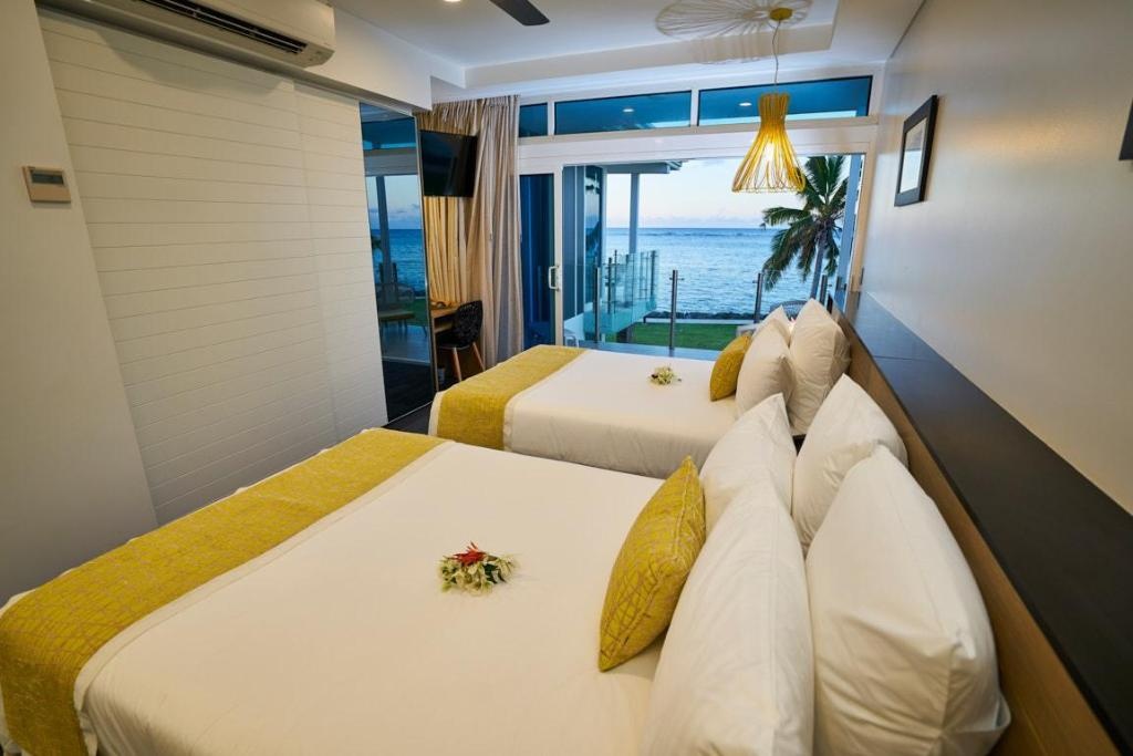 Taumeasina Island Resort  Rooms  Deluxe Ocean View 2 Doubles With Breakfast Room Plan 9