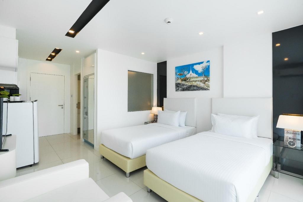 CCR Managed By AHA SmartstayroomsSuperior Twin Guestroom1