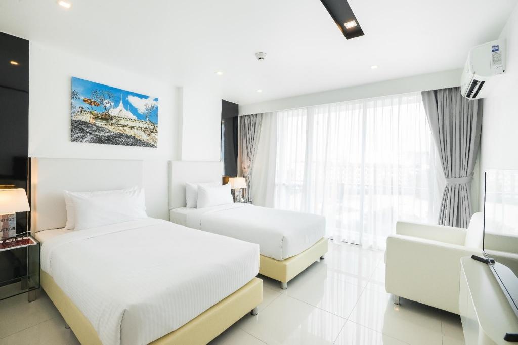 CCR Managed By AHA SmartstayroomsSuperior Twin Guestroom4