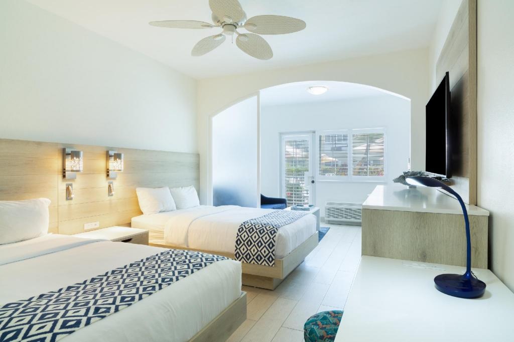 Ports Of Call Resort  Rooms  Deluxe Poolside Room With 2 Double Beds And Terrace Bed 9