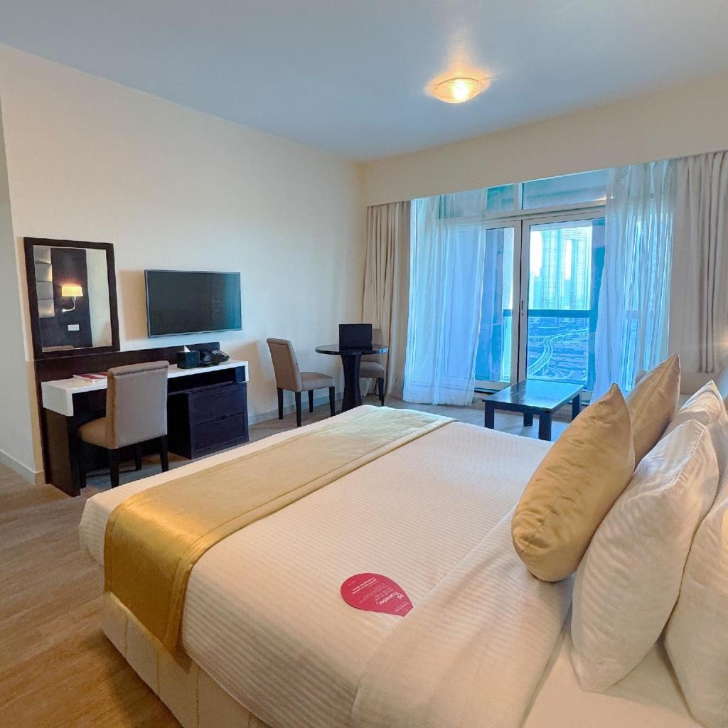 Emirates Grand Hotel  Rooms  Deluxe King Room With Burj Khalifa View Bed 31