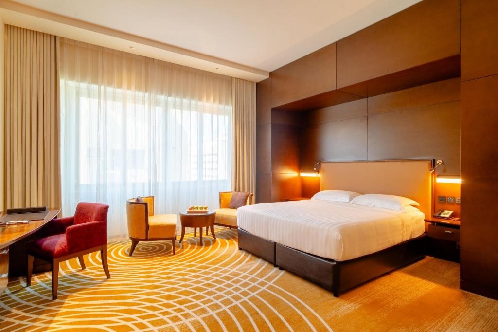 Asiana Hotel  Rooms  Deluxe King Room Bedroom 11