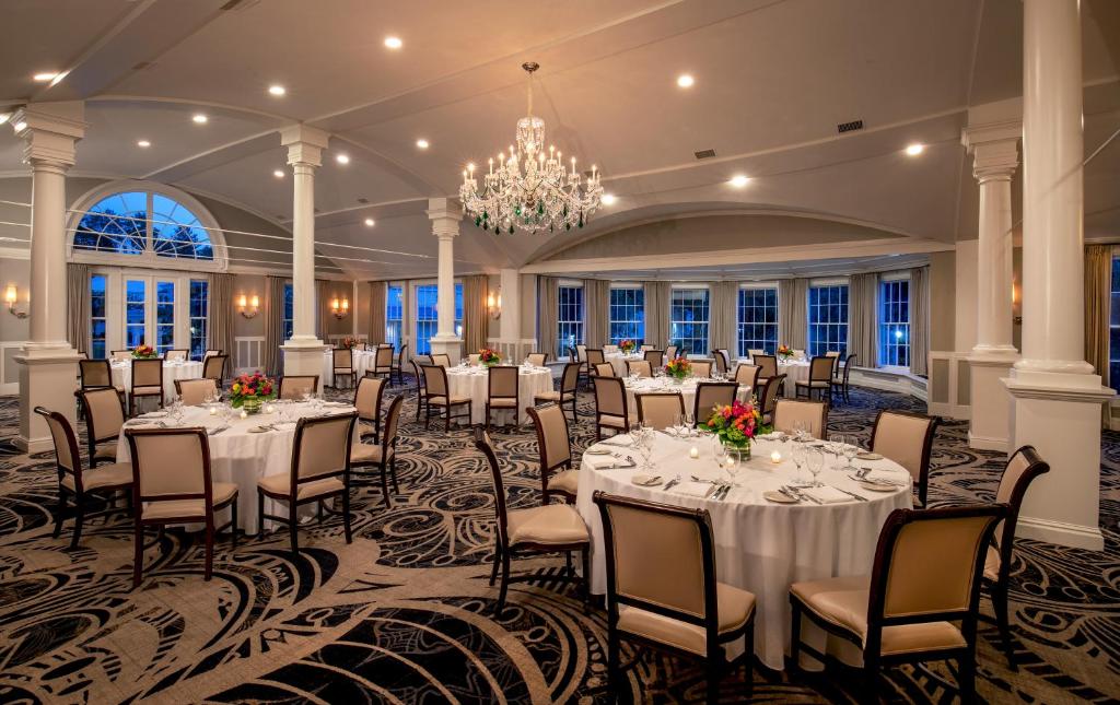 A Dining Room Filled With Tables And Chairs The Equinox Golf Resort  Spa In Manchester Vt
