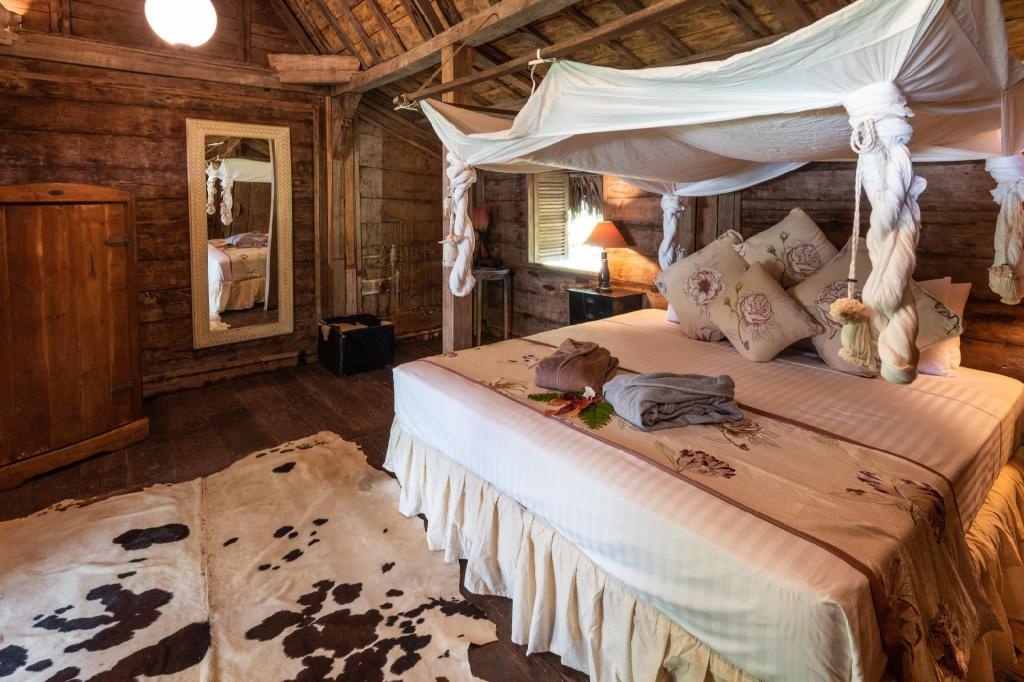 Ratua Private Island Resort  Rooms  2 Bedroom Deluxe Courtyard Villa Bed 1