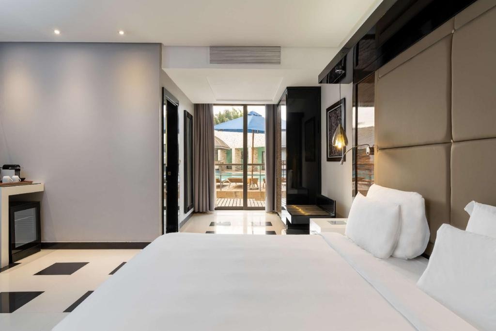 Radisson Blu Hotel Lusaka  Rooms  Premium Room Pool View Terrace Guestroom 3